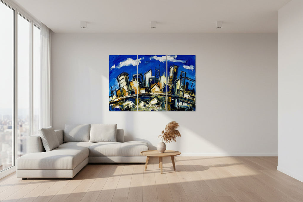 Triptych painting of a cityscape with a blue sky and abstract elements. Hand-stretched three-panel canvas triptych showing the mirrored-wrap edge and deep indigo pigment density.