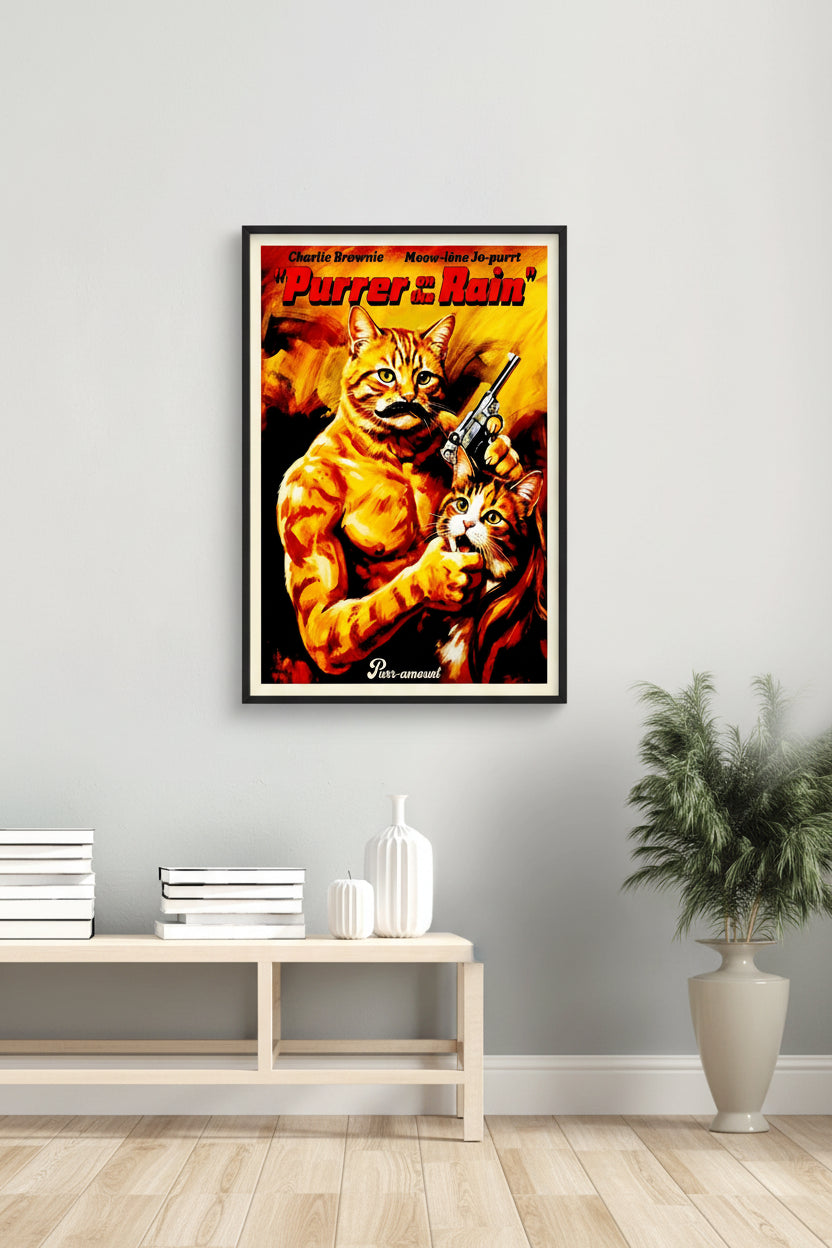 A vibrant orange and yellow movie poster parody titled 'Purrer in the Rain' featuring a muscular ginger tabby cat holding a handgun and another cat, inspired by classic Charles Bronson action films. Hung over a white table and vase.