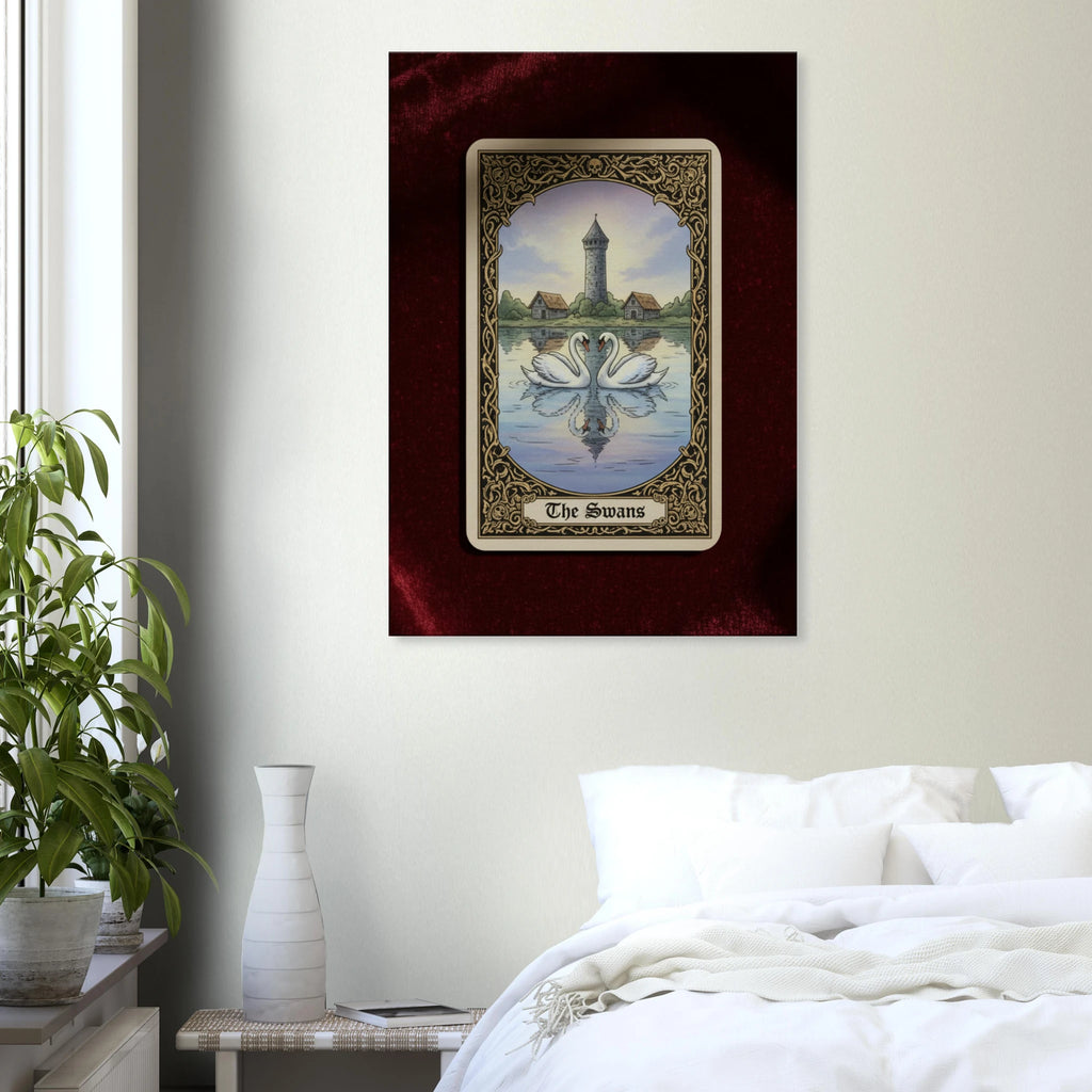 Tarot The Swans esoteric canvas art, mirrored swans with a lighthouse in a neo-symbolist tarot style, 350 gsm museum-quality matte canvas. Hung near a green plant.
