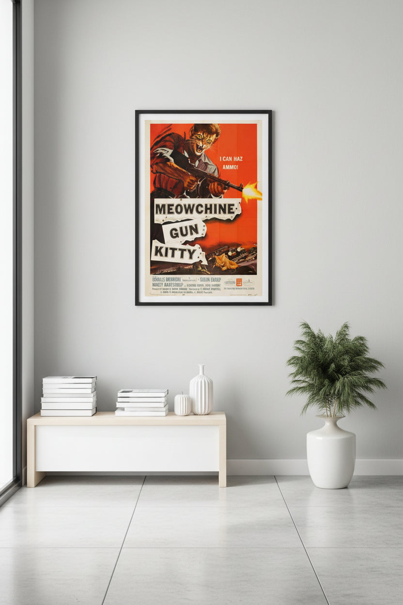 A high-action movie poster parody titled 'Charlie Brownsie in Meowchine Gun Kitty' featuring an angry ginger tabby cat in a heroic pose, surrounded by orange fire and explosions, holding a stylized machine gun. Inspited by the Charles Bronson Movie "Machine Gun Kelly". Hung over a white table with books and a vase.