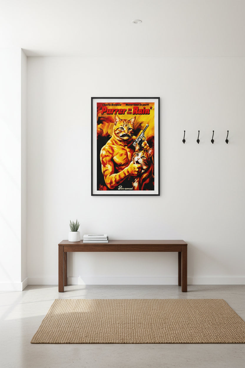 A vibrant orange and yellow movie poster parody titled 'Purrer in the Rain' featuring a muscular ginger tabby cat holding a handgun and another cat, inspired by classic Charles Bronson action films. Hung on a grey wall near a table.